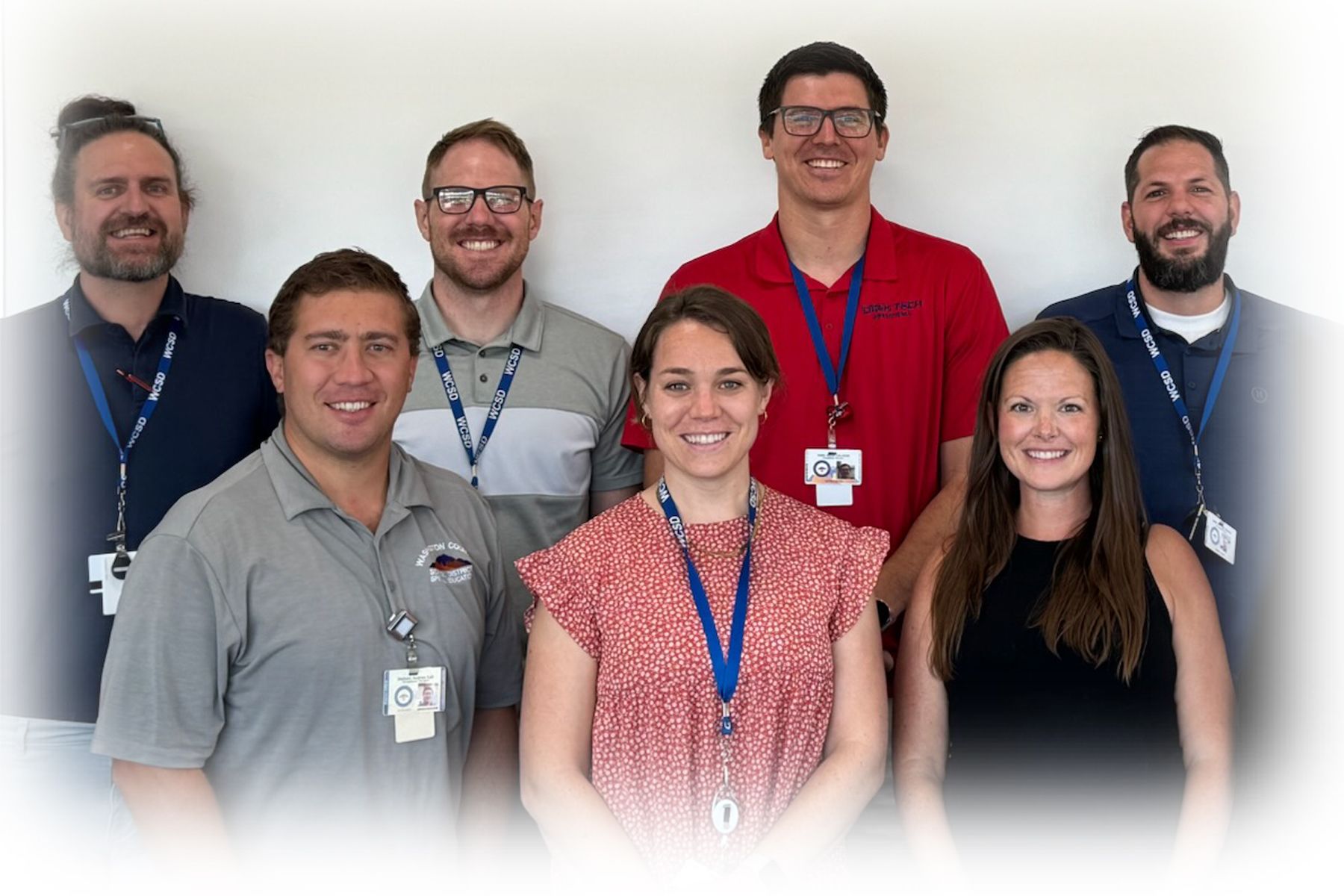 occupational therapists team in front of school wall