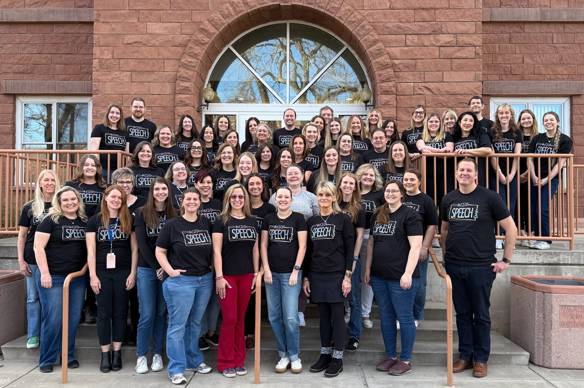 Speech Team Standing in front of district office