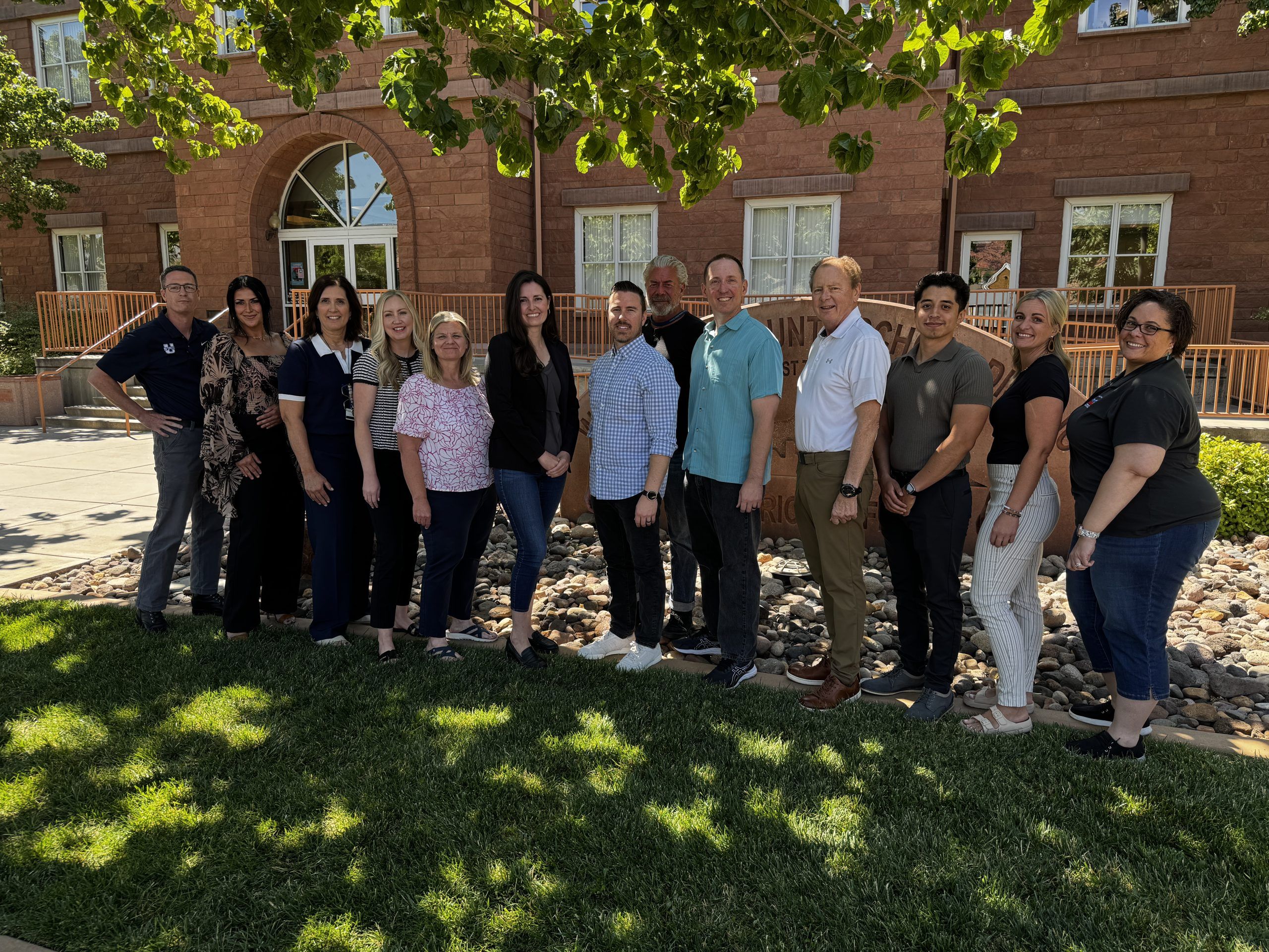 picture of all school psychologists in front of the district office